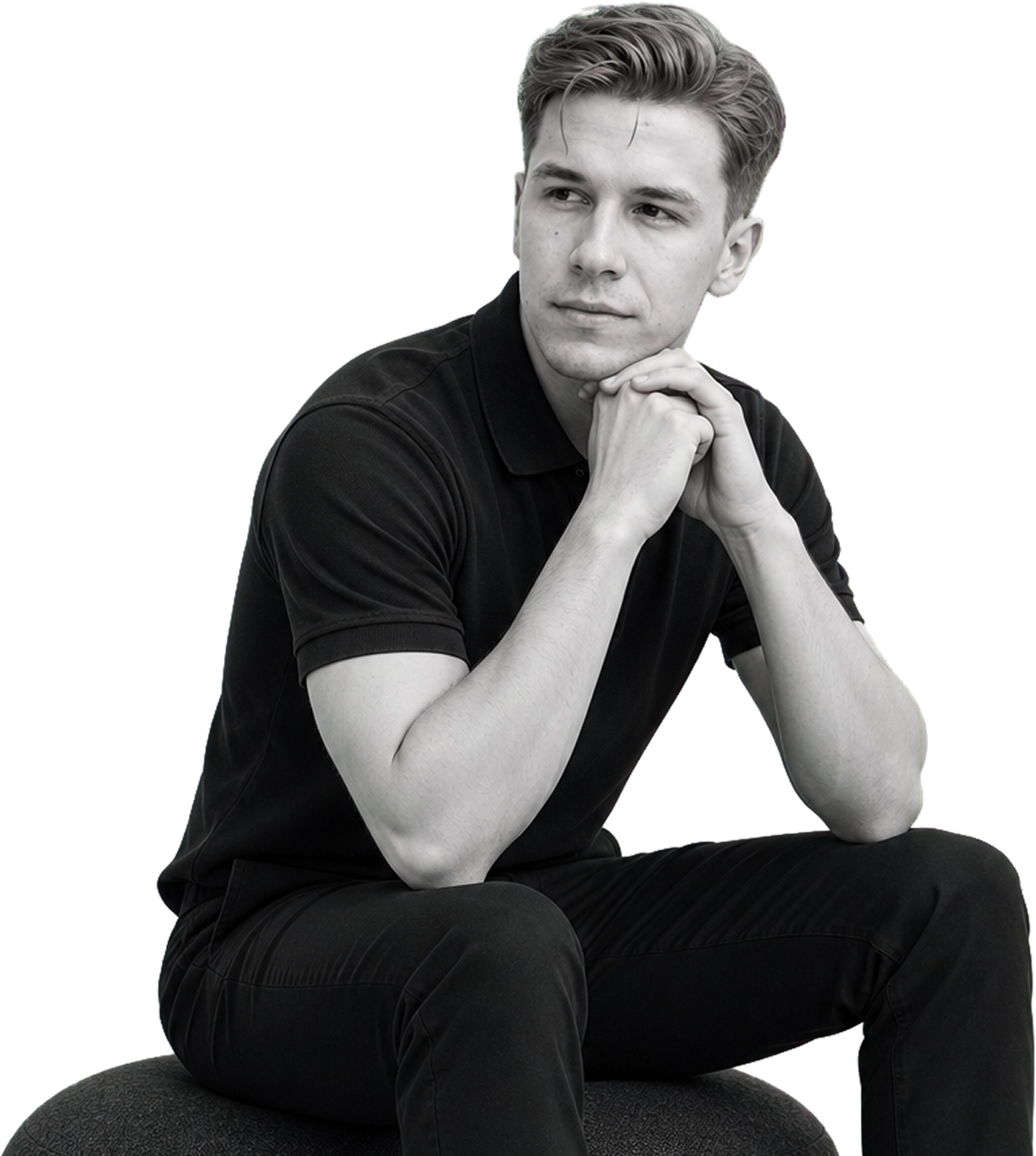 Black and white seated portrait of Nikita Golubev with hands clasped